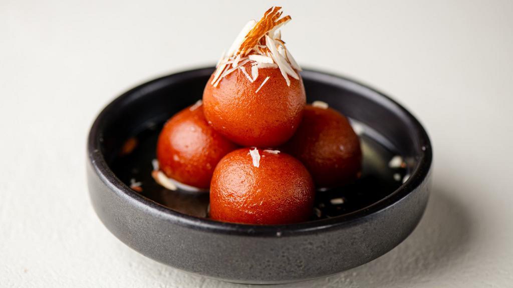 Gulab Jamun · Deep fried balls made of milk powder, flour, butter and milk and then soaked in sugar syrup.
