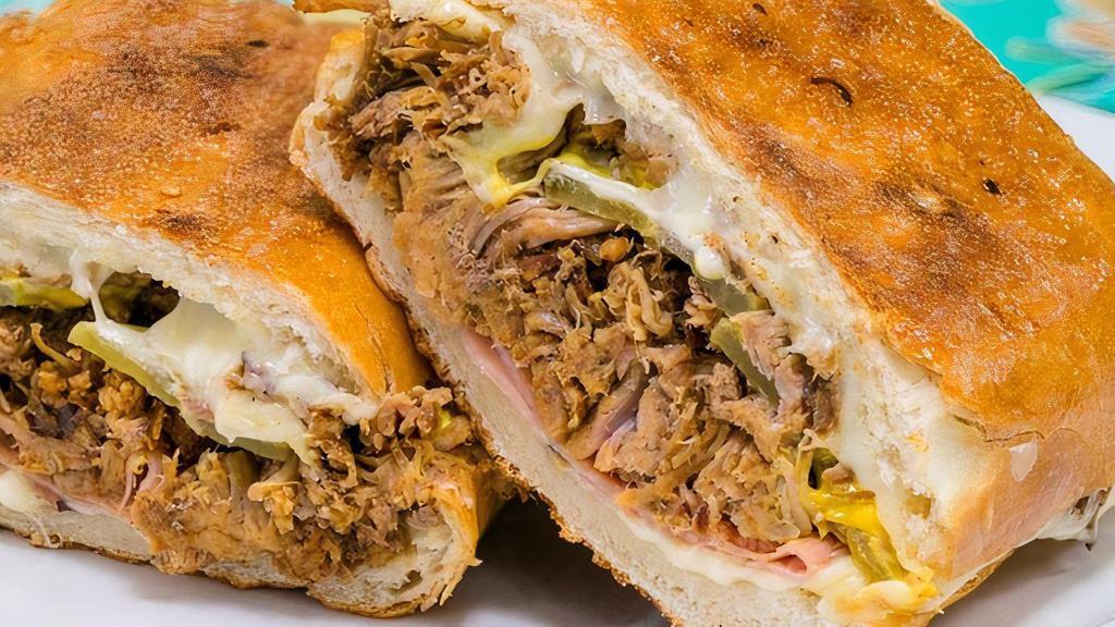 Cubano · pulled pork shoulder, black forest ham, mustard, pickles, aioli and Swiss cheese on grilled French bread