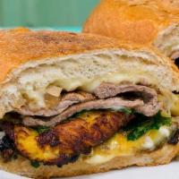 Papito · steak, plantains, caramelized onions, organic arugula, aioli and Swiss cheese on grilled Fre...