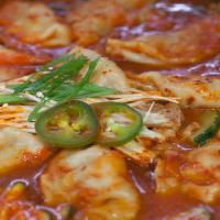 Kimchi Beef Dumpling Stew · Kimchi Stew with Rice cakes, Tofu and Vegetables. 
Spicy.
Large Soup