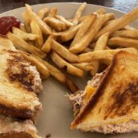 TUNA MELT · GRILLED TUNA TOPPED WITH CHEESE ON GRILLED BREAD.