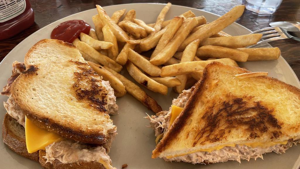TUNA MELT · GRILLED TUNA TOPPED WITH CHEESE ON GRILLED BREAD.
