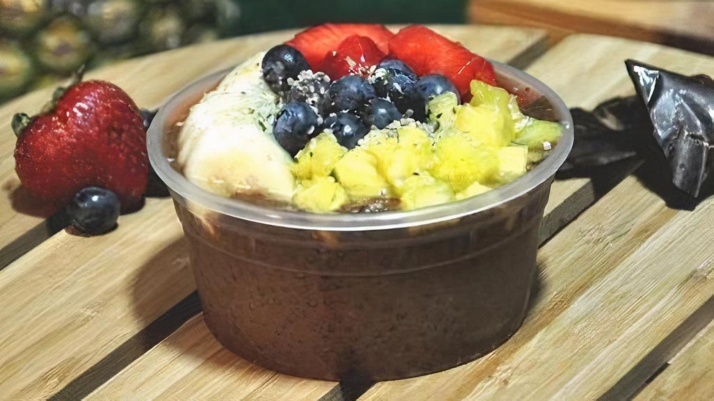 Cacao-Chia Pudding · Germinated chia infused with cacao, pineapple, bananas, strawberries, blueberries.