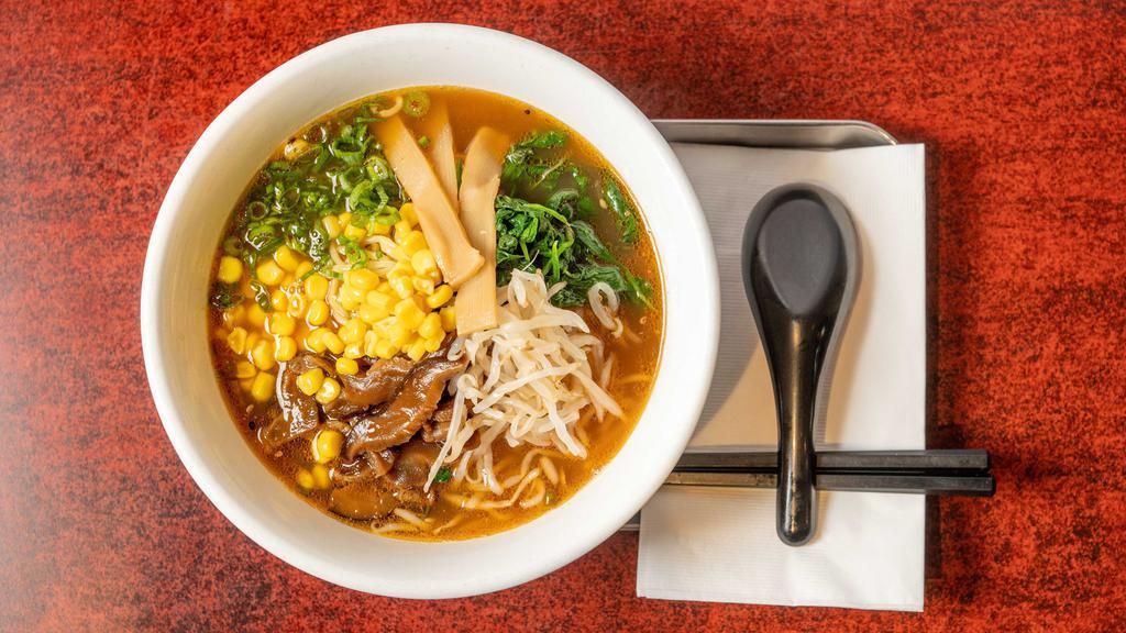 Shoyu Vegetarian Ramen · Full-bodied shoyu broth made of beans, sweet onions, garlic, and tomato. Topped with cabbage, spinach, corn, green onions, shiitake, menma, and bean sprouts.