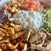 Combo Gyro Plate · Served with Mediterranean rice, salad, hummus, tzatziki.