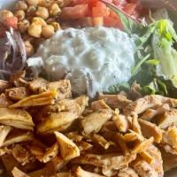 Chicken Gyro Rice Bowl · Greek chicken gyro over rice, salad, piyaz, tzatziki sauce.