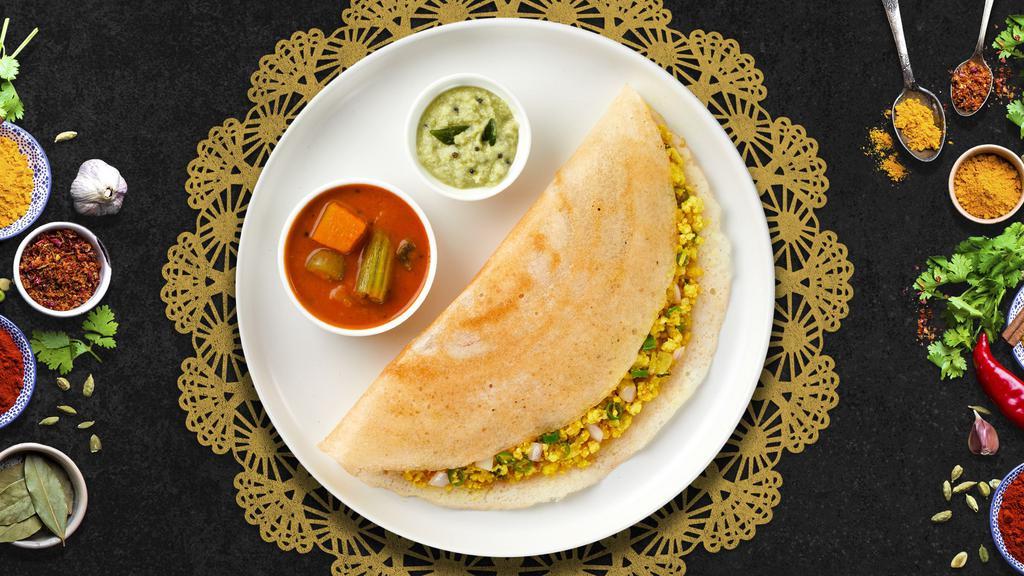 Chunky Cheese Chili Dosa  · Savory crepe made of rice & lentil batter topped off with Mixed Cheese, Chopped green chilies and cilantro.