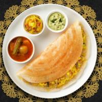 Onion Masala Dosa · Savory crepe made of rice & lentil batter topped with onions served with chutneys and Sambar