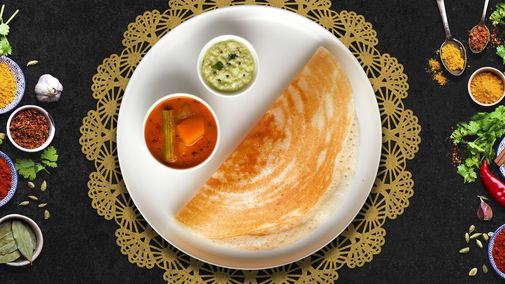 Classic Dosa  · Savory crepe made of rice & lentil batter served with chutneys and Sambar