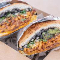 Alpastorta · Toasted Torta Bread, Al Pastor, Pineapple, Melted Cheese, black beans, Mexican sour cream, o...