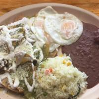 CHILAQUILES RED OR GREEN · SHREDDED TORTILLAS WITH A RED OR GREEN SAUCE SERVED WITH TWO EGGS, FRIED BEANS AND RICE.