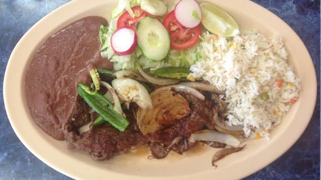 CARNE ASADA · CARNE ASADA  - 
MARINATED GRILLED STEAK
TOPPED WITH ONIONS.