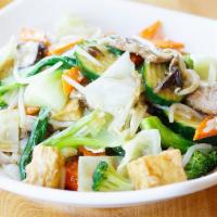 28. Vegetable Chow Fun · Flat rice noodle, mixed vegetables, organic tofu, gluten, bean sprouts and mushroom, stir-fr...