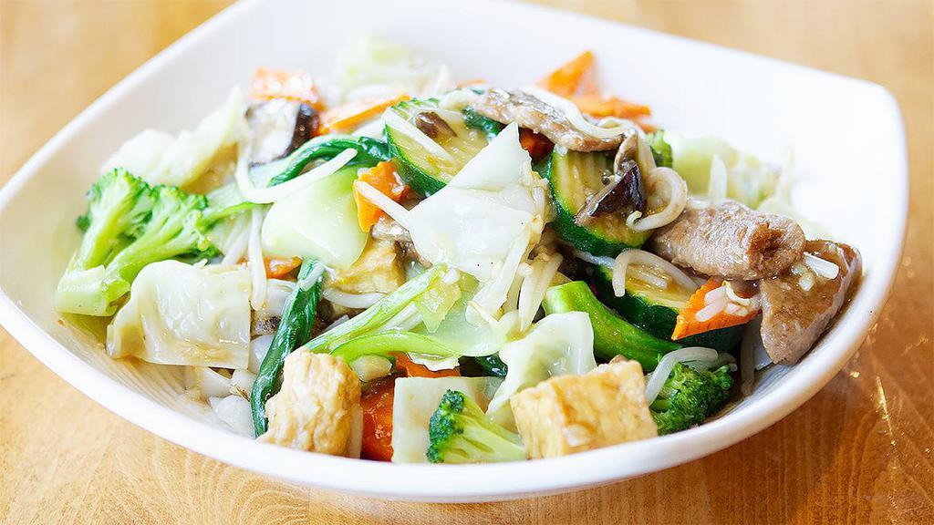 28. Vegetable Chow Fun · Flat rice noodle, mixed vegetables, organic tofu, gluten, bean sprouts and mushroom, stir-fried in house garlic sauce. Gluten free option available.