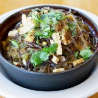 31. House Special Rice Clay Pot · Seasoned tofu, gluten, mushroom, bean threads, onion and ginger cooked with fragrant rice. G...