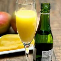 Mango Mimosa · A champagne split and orange juice with mango. (270 Cal)