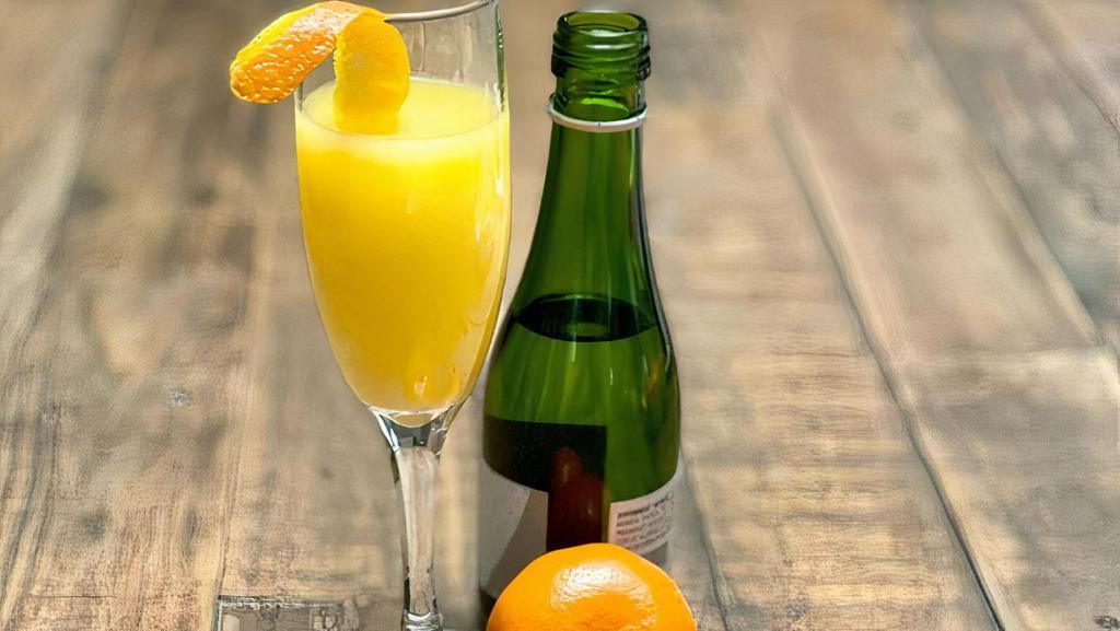 Mimimosa · A champagne split and orange juice with a tangerine burst. (220 Cal)