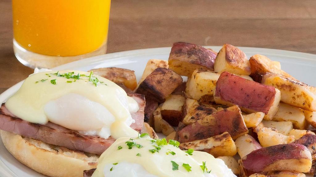 Eggs Benedict · Hickory-smoked ham and poached eggs topped with hollandaise sauce on a grilled English muffin. Served with a side of roasted potatoes. (670 cal) Available every day until 2:00PM