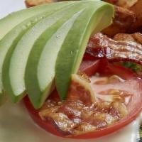 Bacon Avocado Omelet · Three eggs, hickory-smoked bacon, spinach, tomatoes, Monterey jack cheese and avocado. Serve...
