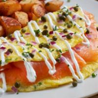 Smoked Salmon Omelet · Three eggs, cold-smoked Atlantic salmon, diced red onions, capers and sour cream sauce. Serv...