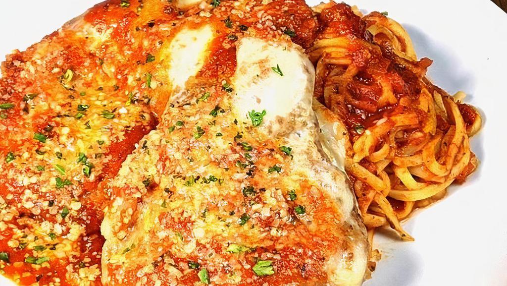 Chicken Parm. · Crispy hand breaded parmesan chicken breast with melted mozzarella and marinara sauce over linguine. (1290 Cal)