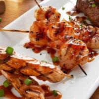 Brochette Trio · Skewers of grilled spicy peanut chicken, teriyaki shrimp and ground beef with red wine sauce...