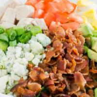 Cobb Salade · Slow-roasted turkey, bacon, chopped egg, avocado, tomatoes, green onions and crumbled bleu c...