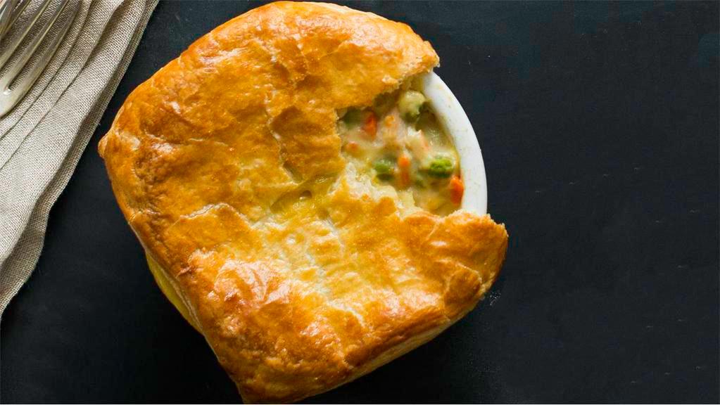 Pot Pie · Freshly baked with roasted chicken, peas, carrots, onions and potatoes folded into a creamy herb sauce. Topped with aflaky crust. (860 Cal)