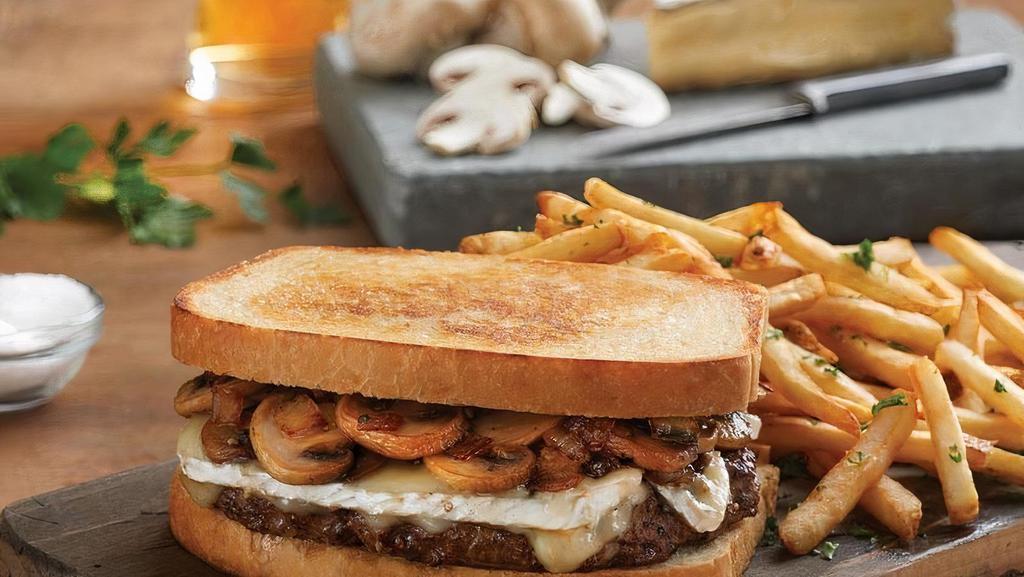 Mushroom Brie Burger · 100% USDA premium beef patty with sautéed mushrooms, caramelized onions, and melted brie on grilled sourdough. (890 cal).