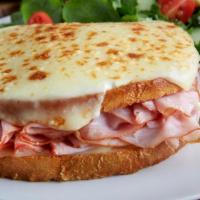 Croque Monsieur · Smoked ham and swiss cheese served warm on toasted sourdough topped with mornay sauce and me...