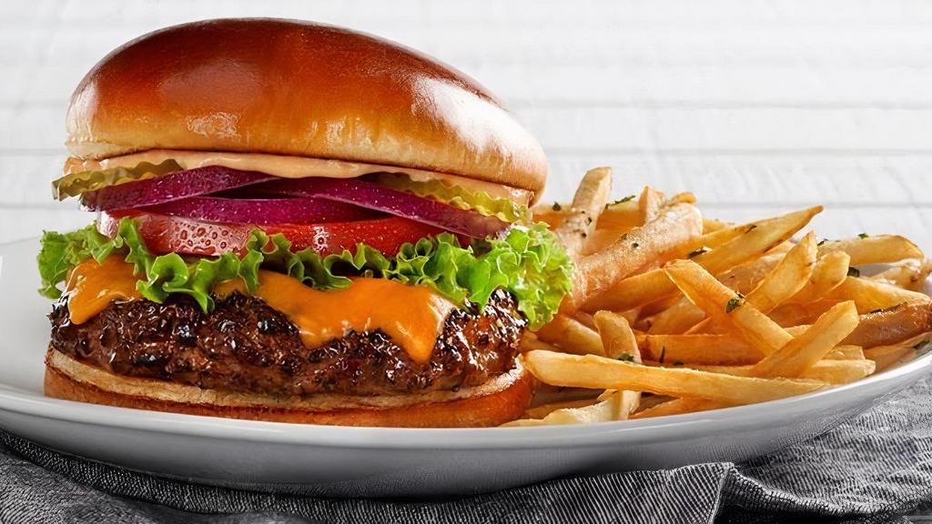 Cheese Burger · 100% USDA premium beef patty with your choice of cheese, lettuce, tomatoes, red onions, pickles and thousand island dressing on a toasted brioche bun. (840-870 cal) .