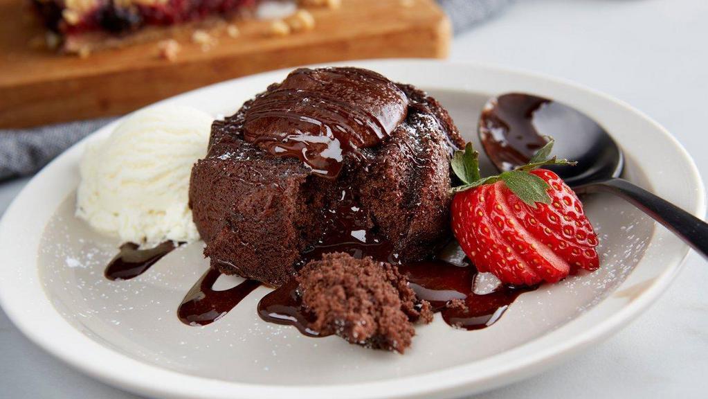 Molten Lava Cake · Warm molten chocolate cake with vanilla ice cream and a strawberry. (510 Cal)