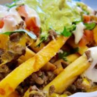 Nacho Fries · Choice of meat, white, or yellow cheese sauce, salsa ranchera, sour cream, guacamole and jal...