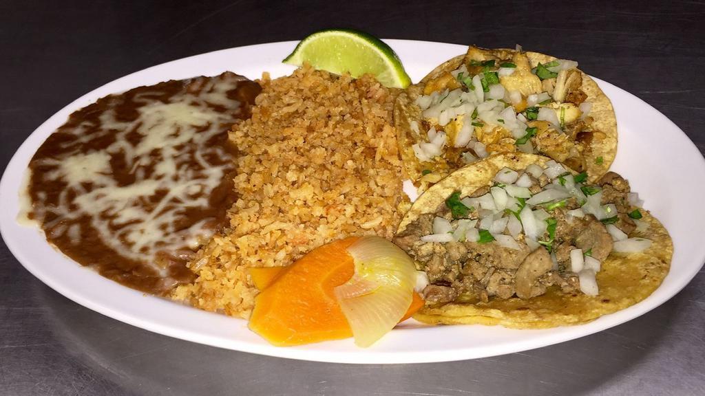 Taco Plate Deluxe · Beans, rice, two regular tacos.
