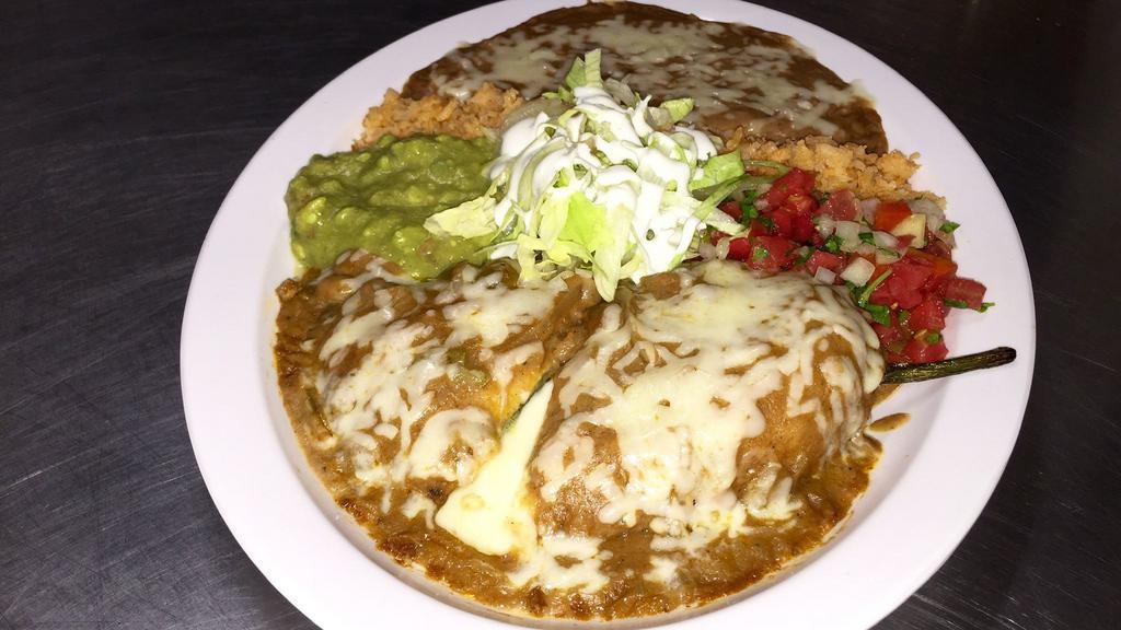 Chile Relleno Plate · Cheese, beans, rice, guacamole, salsa ranchera, sour cream, lettuce with four corn or flour tortillas.