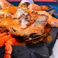 seafood molcajete · crab.mussles,shrimp,clams,octopus,scallops,tilapia red salsa