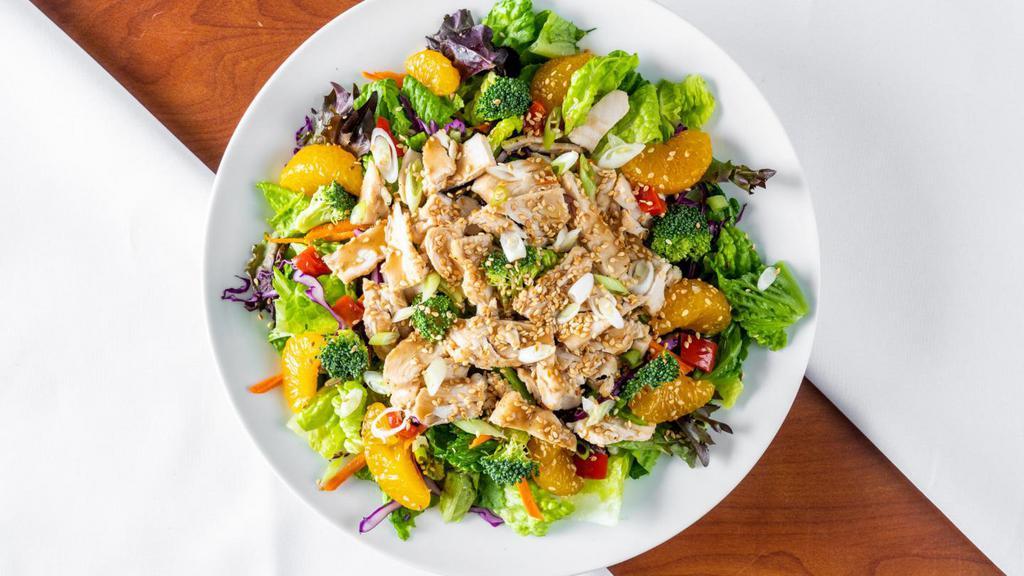 CHINESE CHICKEN SALAD · Shredded lettuce , red cabbage,  veggies , marinated chicken,  mandarin segments, crispy noodles , green onions ,toasted sesame seeds with pan Asian dressing.