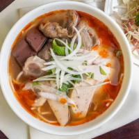 Bun Bo Hue Dac Biet · Combo Spicy beef noodle soup with beef shank, ham, sliced pork, tendon, and pork blood cake.
