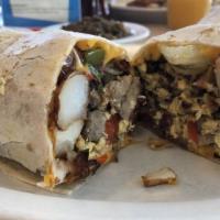 Jose's Breakfast Burrito · A giant flour tortilla filled with fluffy scrambled eggs, country potatoes, bacon, cheese, b...