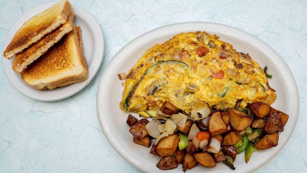 Vegetarian Omelet · Cheese, zucchini, tomatoes, mushrooms and onions.