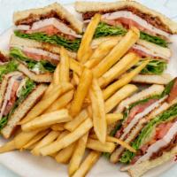 Club Sandwich · Three layers of bread prepared with turkey, bacon, lettuce, tomato and mayo.