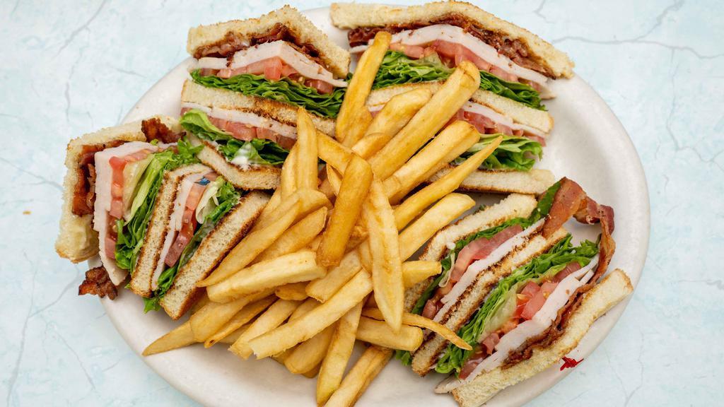Club Sandwich · Three layers of bread prepared with turkey, bacon, lettuce, tomato and mayo.