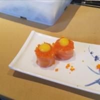 Tiger Eyes · crab meat, salmon, tobiko, and quail egg