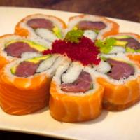 Paul Blossom Roll · Tuna and avocado, topped with salmon and tobiko.