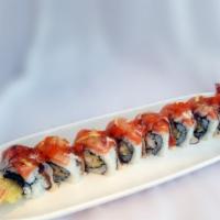Island Roll · Shrimp tempura, real crab meat and cucumber, topped with salmon, sliced lemon, tobiko and Jo...
