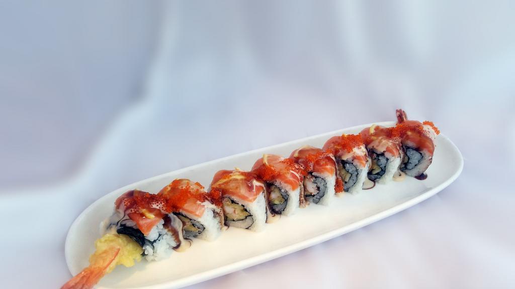 Island Roll · Shrimp tempura, real crab meat and cucumber, topped with salmon, sliced lemon, tobiko and Joy special sauce.