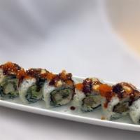 Giant Roll · Soft-shell crab, avocado, cucumber and crab meat, topped with unagi, tobiko and unagi sauce.