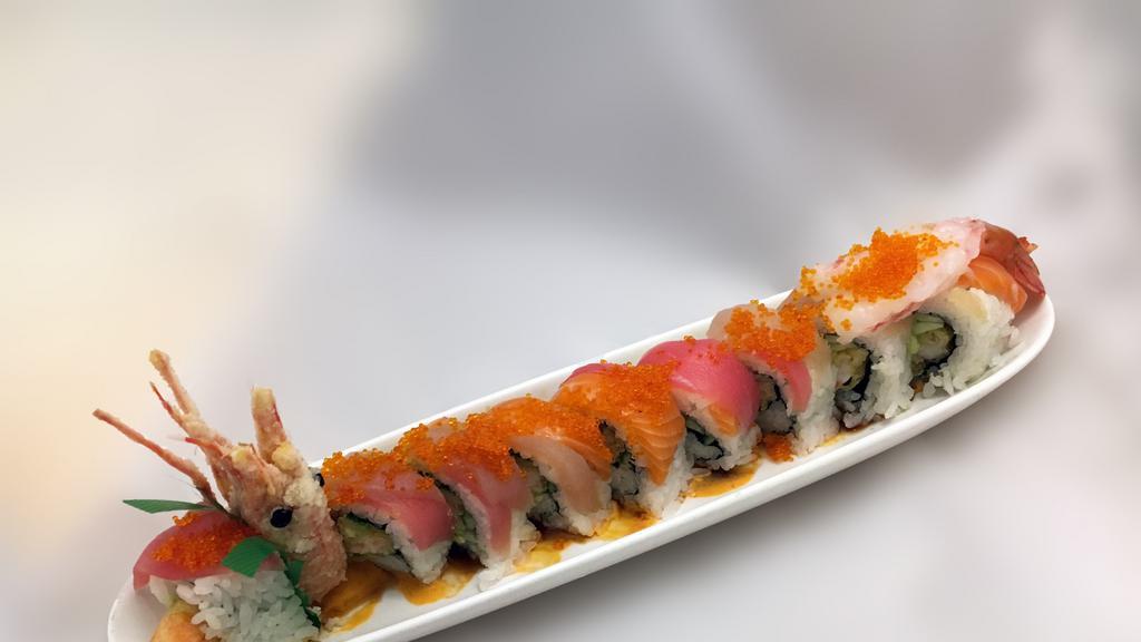 Drunken Dragon Roll · Ama-ebi, shrimp tempura and cucumber, topped with tuna, salmon, white tuna, tobiko and a side of Joy special sauce.