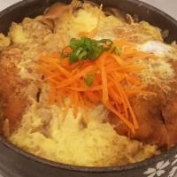 Katsu Donburi Entrée · Breaded lean pork loin, sliced vegetables and scrambled eggs simmered with house sauce.