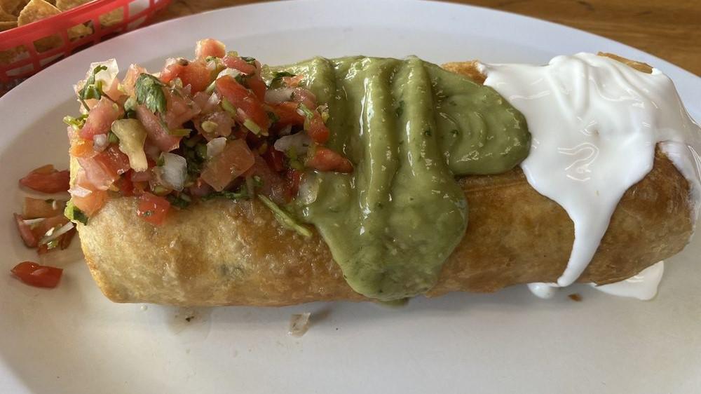Chimichanga · Meat, cheese inside, cover with guacamole and sour cream rice, beans and salsa et side.
